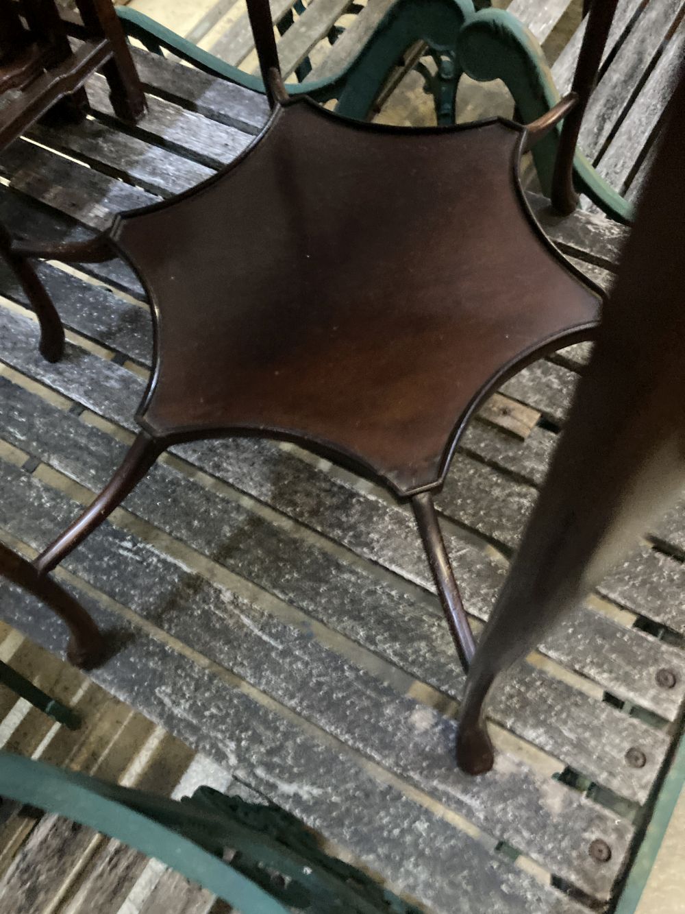 A late Victorian mahogany shaped circular topped two tier table, 67cm diameter, 72cm high